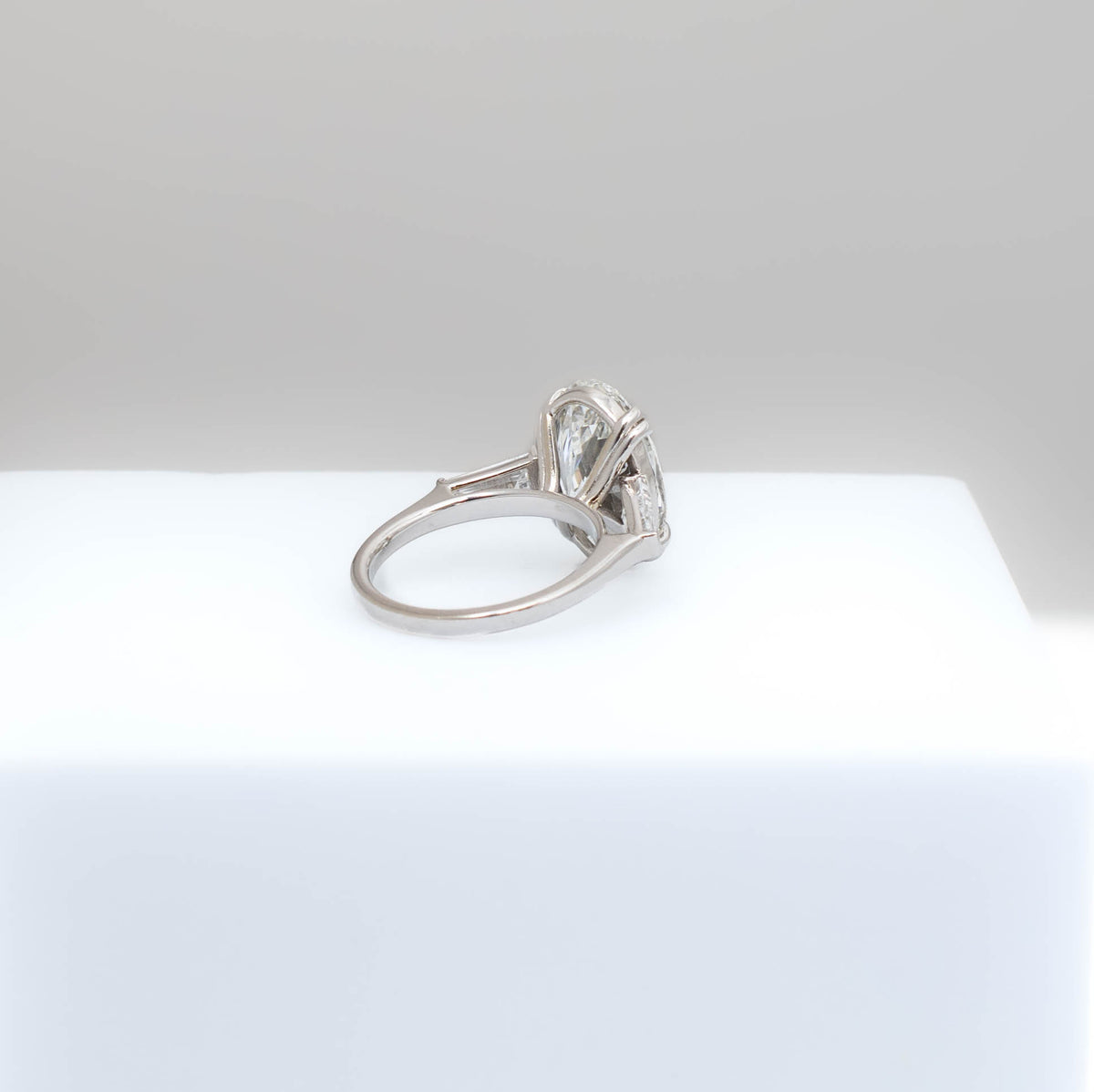 Gold and diamond ring on a white background