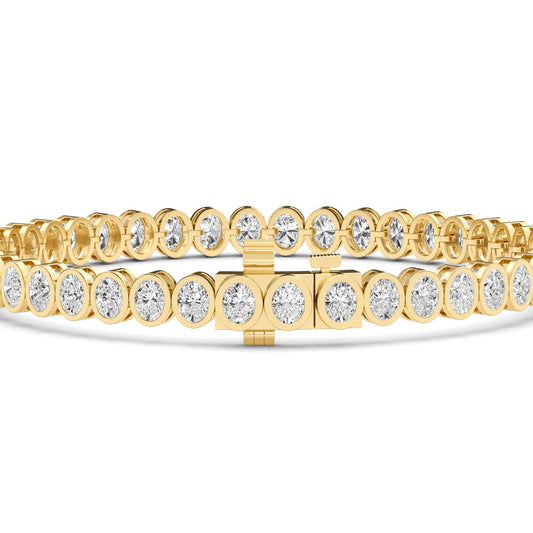 yellow gold and diamond bracelet against a white background