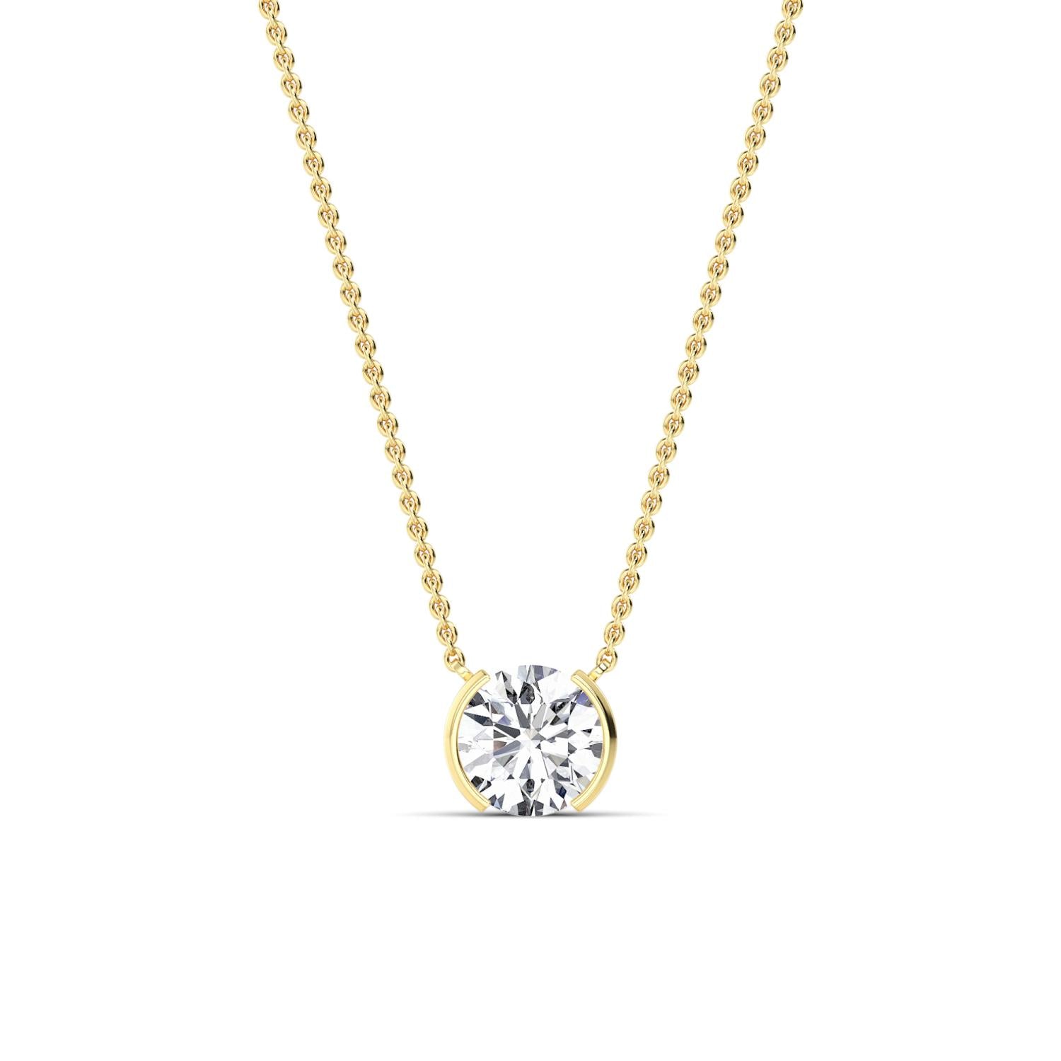 Gold necklace with a diamond pendant on a white background
