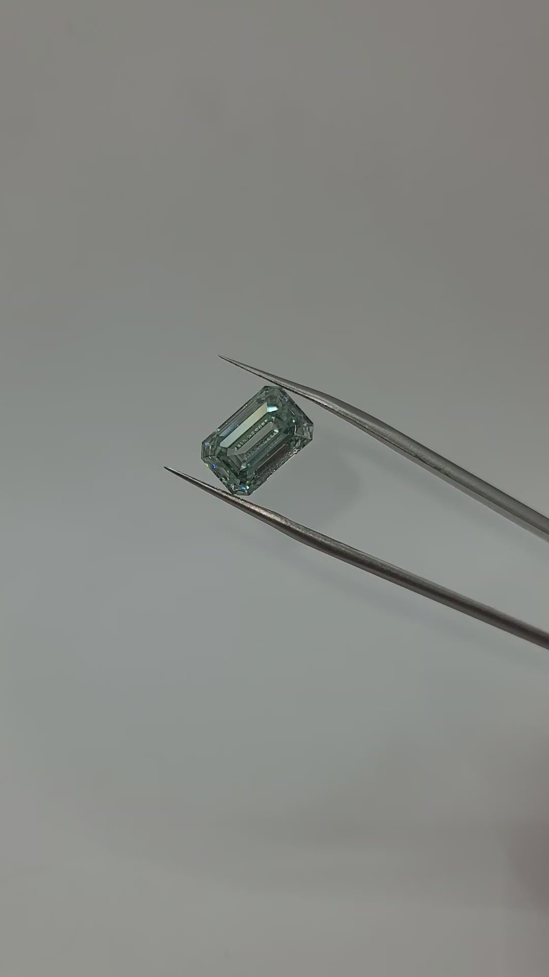 Video of emerald cut green lab diamond