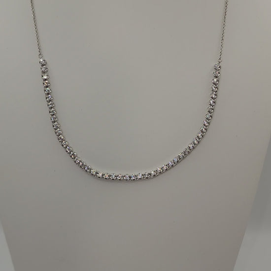 White Gold and Diamond necklace on a mannequin bust against a white background
