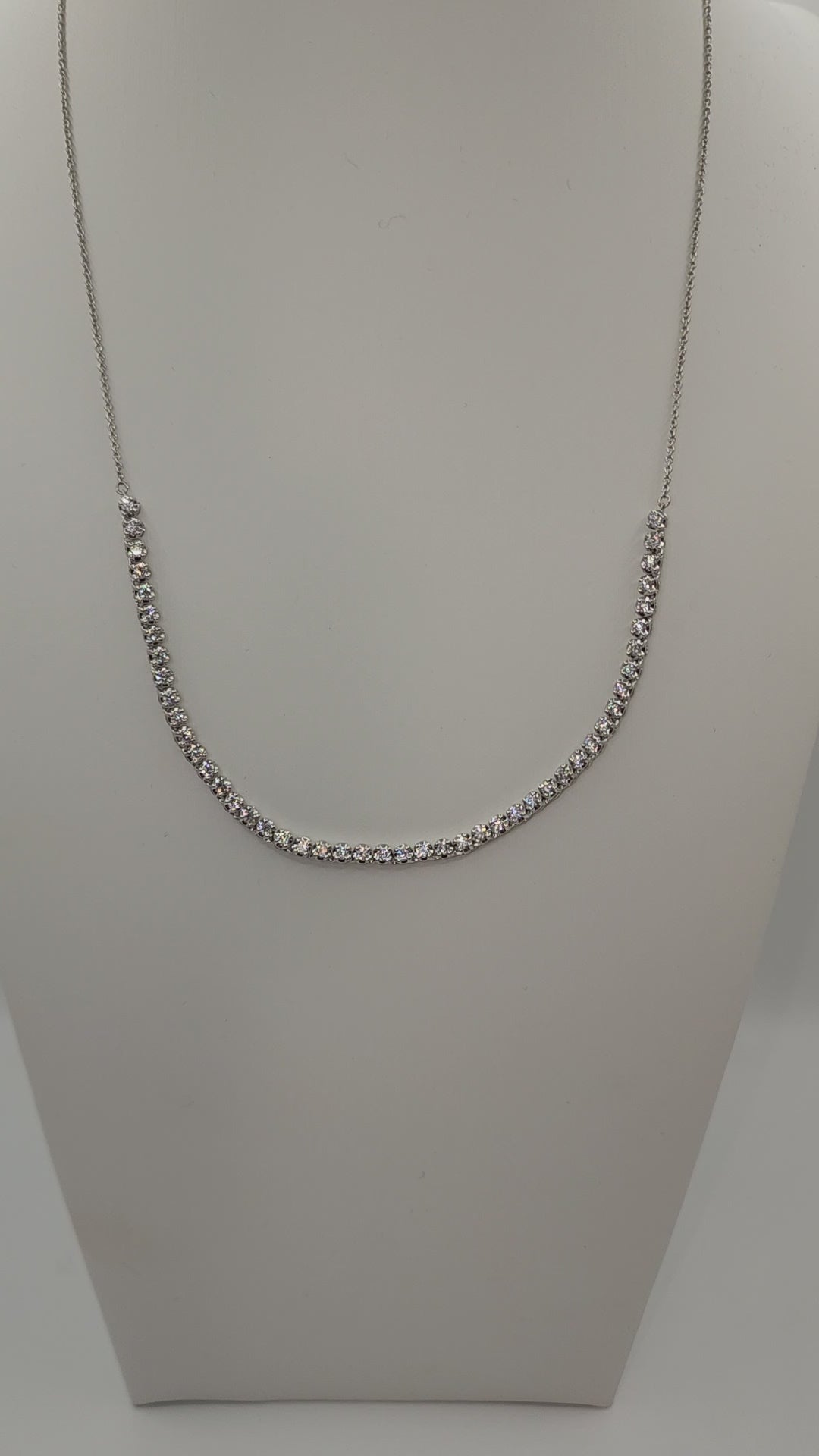 White Gold and Diamond necklace on a mannequin bust against a white background