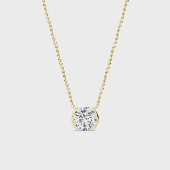 yellow gold diamond necklace on a white background