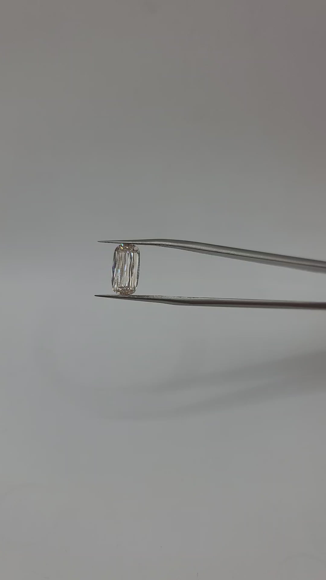 Video of lab grown crisscut diamond held by tweezers