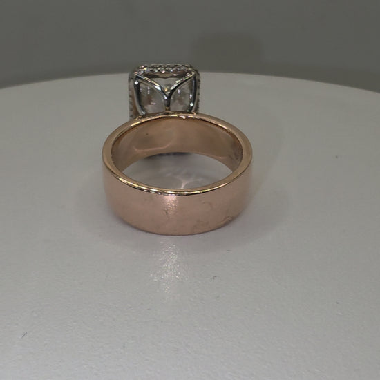 Diamond ring on a hand by white background