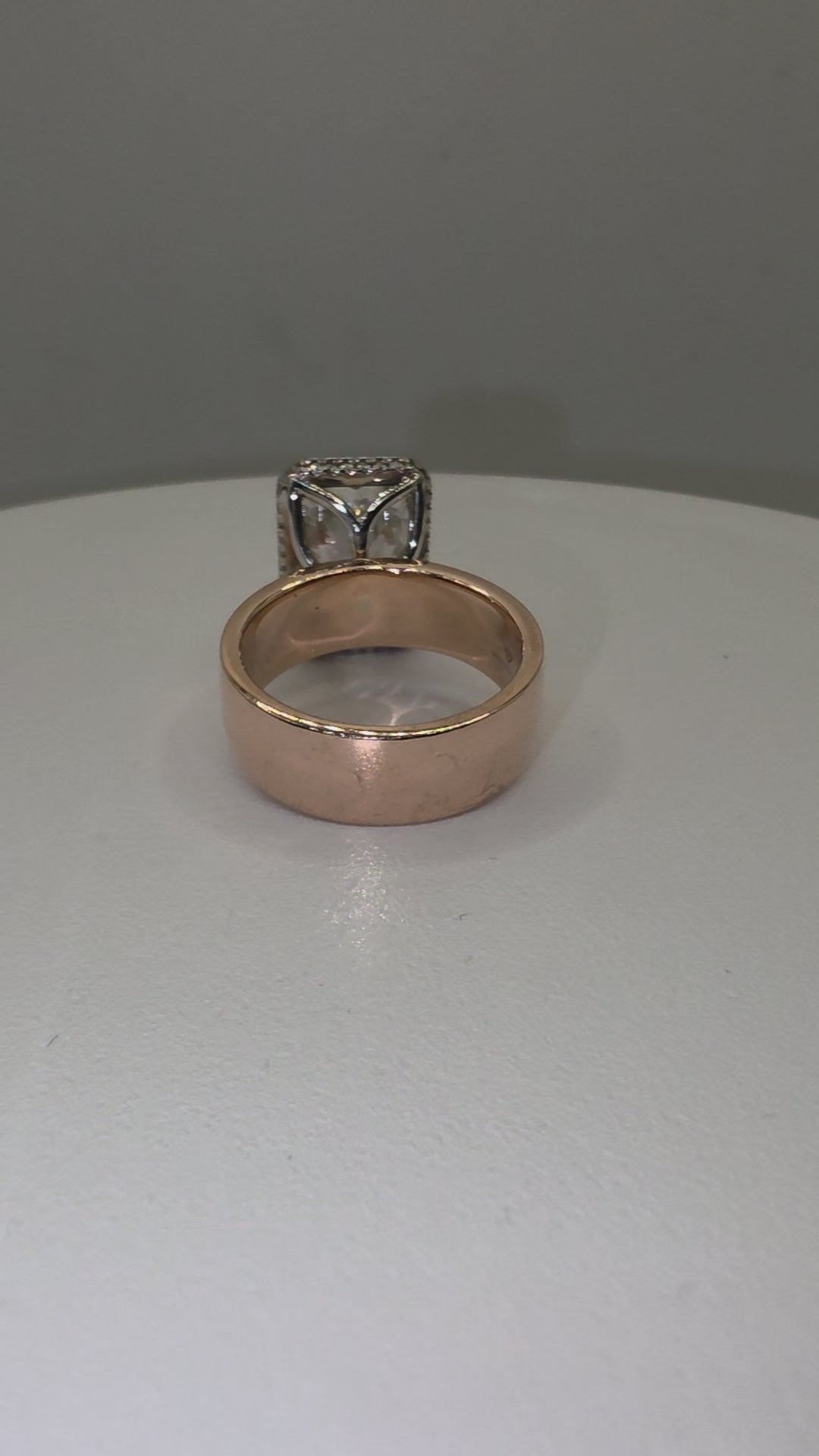 Diamond ring on a hand by white background