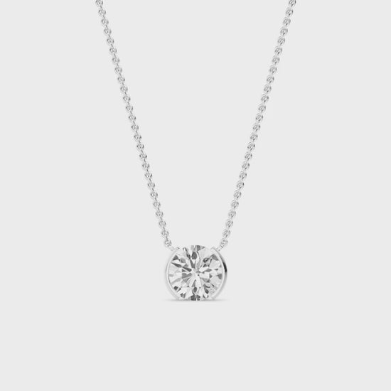 round diamond necklace on a white background