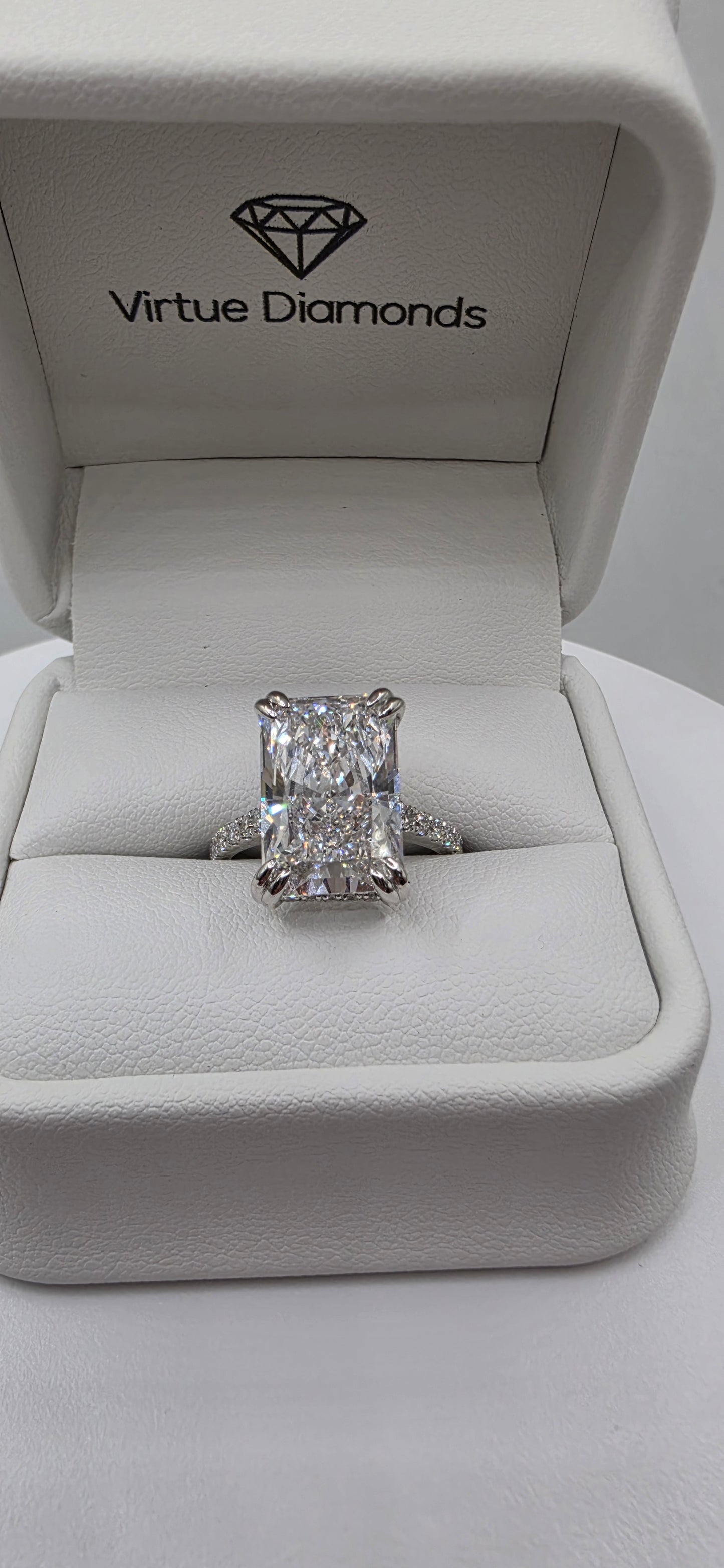 Diamond ring in a white box with 'Virtue Diamonds' branding.
