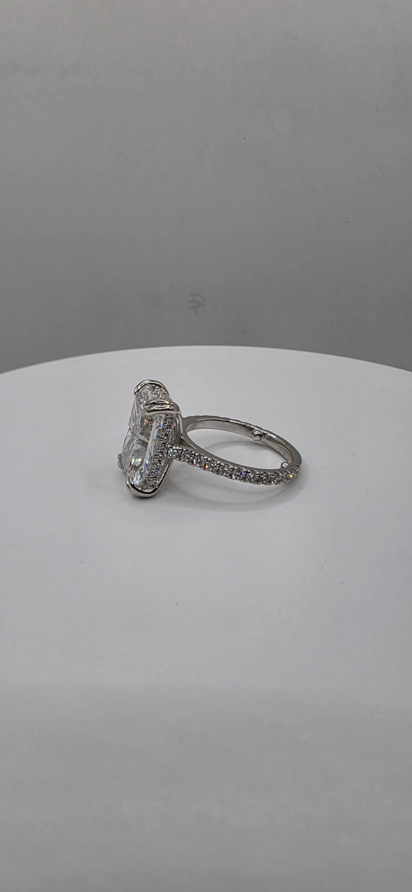 White gold and diamond ring on a white background